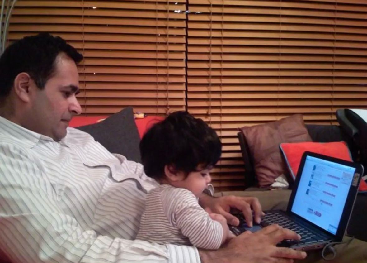 A childhood photograph at a laptop